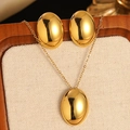 Elegant gold oval jewelry set featuring minimalist polished pendant necklace and stud earrings - Gold Minimalist Egg Shape Mirror Jewelry Set