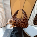 Brown plush leopard print handbag with cute doll charm and metal top handle strap - Leopard Brown