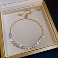 Close-up of elegant 14K gold plated tennis bracelet with sparkling zircons in a box - Gold Circle (Real Gold Plated)