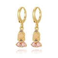 Detailed view of gold earrings with pink teardrop rhinestones and opal beads - Pink