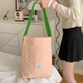 Detail of pink heart quilted shoulder bag with contrasting green straps and woven label - Peach Pink (Green Strap)