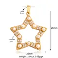 Detailed view of a gold star pendant featuring inlaid pearls and sparkling crystals - Gold Hollow Star