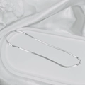 Close-up of a silver flat snake chain necklace on white marble with a lobster clasp - 3mm Blade Chain / 40CM / Silver