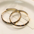 Leopard print hoop earrings with gold hooks on a minimalist white tray display - Brown Black Leopard Hoop Hook (E33065-1)