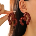 Deep red wavy irregular heart shaped earrings with glossy enamel finish on model - Deep Red Irregular Heart Earring (6531)