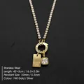 Elegant 14K gold plated stainless steel necklace featuring a 'W' tag and crystal pendants - Letter W (XNL0116)