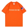 Vibrant orange cotton T-shirt with white FREEDOM print and flag patch on sleeve - S / Orange