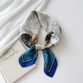 Elegant silk scarf with blue camellia floral print and golden accents in knot style - Hundred Petals Blue