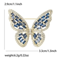 Elegant gold butterfly brooch featuring blue gemstones and white zircons with size details - Blue