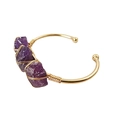 Detail of handcrafted gold wire wrapped around raw purple crystals on a vintage open cuff - Purple Crystal