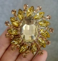 Elegant sunburst brooch featuring a large yellow oval gemstone set in gold-tone alloy - XD825249-1 Yellow Crystal