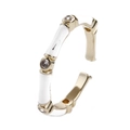 Detail of adjustable gold bamboo ring with white enamel and sparkling zircon accents - White