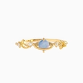 Macro detail of gold Saturn-inspired ring featuring a blue moonstone and vine accents - US 7 / Gold