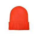 Macro shot of orange knit beanie texture showing detailed weave and ribbed fold-over cuff - Red