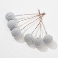 Detail of silver textured Christmas berries on brown wire stems for festive DIY crafts - Silver