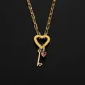 Golden stainless steel heart clasp necklace with key pendant and pink crystal detail - Letter I