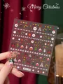 Weihnachts-Nagelaufkleber mit goldenen Schneeflocken und Weihnachtsmann-Motiven in Rot - Weihnachten Nagelsticker Aha-073