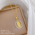 Close-up of gold oval Virgin Mary pendant with cubic zirconia inlay in jewelry box - Gold Virgin Mary (H544)