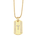 Detailed macro view of golden ball chain necklace with Y-letter zircon military pendant - Letter Y
