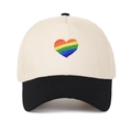 Retro five-panel trucker hat featuring cream crown, black brim and rainbow heart embroidery - Black