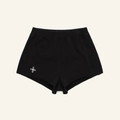 Detailed close-up of black knit sports shorts with white embroidered flower logo on hem - S / Wild Black