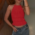 Detail of red halter neck ruffle top with pleats paired with denim jeans for women - S / Red