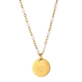Detailed shot of golden bead chain necklace featuring a minimalist heart pendant - Heart