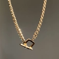 Elegante collana a maglia cubana dorata con una chiusura a T dal design vintage unico - Stile Girocollo di Base