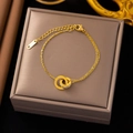 Bracelet de cheville or rose avec anneaux entrelacés et chiffres romains sur coffret - E79 Bracelet Double Anneau Romain Or