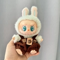 Labubu plush doll accessory featuring green bunny hood and brown textured overalls - Chocolate Biscuit Bear / First And Second Generation Keychains Are Compatible With La Cloth Dolls. Dolls Not Included.