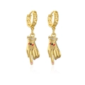 Detail of gold-plated hand-shaped earrings with red eye design and crystal wrist - Gold/Pink Nails