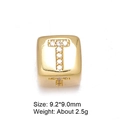 Macro shot of 8mm gold-plated letter T bead with micro-pave cubic zirconia settings - Letter T