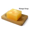 Handmade mango essential oil soap with silk protein on a wooden dish stand - Mango Soap