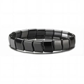Polished black hematite magnetic bracelet with wavy irregular beads on white background - Water Wave Style