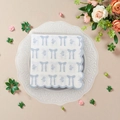 Blue bow and floral print square cocktail napkins with scalloped edges on a white plate - Blue Bow