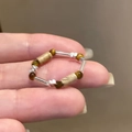 Vintage kralenring met tijgeroogstenen en zilveren accenten voor een retro uitstraling - Bruine Tijgeroog Metalen Kralenring