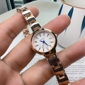 Elegant rose gold women's quartz watch with blue hands and diamond-set white dial - Gold Band White Dial