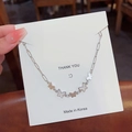 Silver 18K titanium steel butterfly pendant necklace on a white Thank You card - X383 Silver Multi-Butterfly