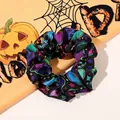 Detail of Halloween hair scrunchie with colorful skull and star patterns on black fabric - Skull / Large Size