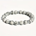 Elastic beaded bracelet with natural map stone beads and silver spacers on white background - Map Stone with Hematite Spacer