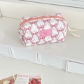 Detail of white quilted makeup bag with pink bow pattern and Good Night label - Octagonal Pouch / Pink