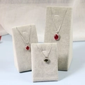 Three jewelry necklaces with red and green gems on gray velvet jewelry display stands - Set of 3 (L/M/S) Pendant Stand Gray