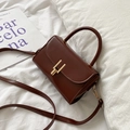 Retro brown leather crossbody bag with structured design and gold metal buckle detail - Dark Brown