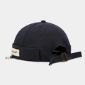 Detail view of Miki hat showing the side woven label with metal ring and adjustable buckle - Adjustable / Ring Letter Patch Dark Grey