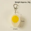 Realistic PVC boiled egg keychain with white protein and yellow yolk, 5cm x 3.5cm - Half Hard-boiled Egg - Lobster Clasp