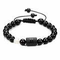 Detail of Gemini black onyx beaded bracelet with white bead and adjustable cord - Gemini