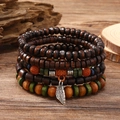 Bohemian multilayer wood bead bracelet set with feather charm on rustic wood background - Old Leaf 5-piece Set