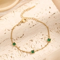 Gold-plated stainless steel bracelet featuring three green square-cut zircons and lobster clasp - S671 Emerald Bracelet Gold