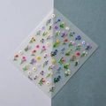 Detailed view of 5D floral nail stickers with intricate daisy and lavender relief patterns - Colorful Floral Style (TS-070)