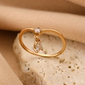 Elegant gold-finish ring featuring a round stud and a dangling teardrop crystal stone - Gold Pear Drop Zirconia Ring (1957)